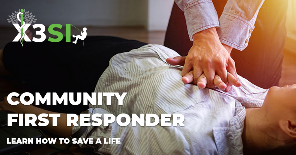 A picture of a woman lying on the floor with a person off screen performing CPR. The x3si logo is overlayed and with the text: Community First Responder, learn how to save a life underneath